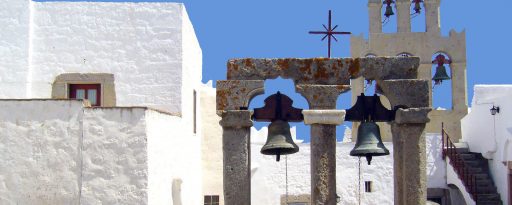 White buildings and church bells on the island of Patmos in Greece
