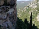Wide shot of the Monastery of Agios Ioannis Prodromos clinging to the cliff in Arcadia, Greece