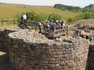 Tour group exploring the Roman fort at Vindolanda on Hadrian's Wall in England
