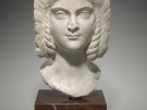 A bust of the empress Julia Domna, looking directly at us in a pale white, pipeclay coloured marble