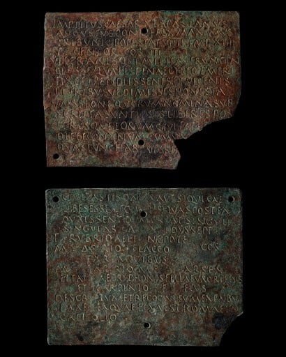 Two parts of a Roman soldier's discharge diploma made of nearly square bronze rectangles