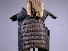 A Roman armour-like long jacket and headgear made of crocodile skin