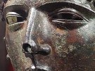 a masked Roman cavalry helmet in bronze