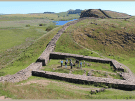 Small group exploring one of the Roman milecastles on Hadrian's Wall