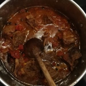 Step 4: tomatoes and spices have been stirred in.