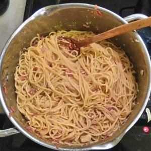 Step 5: I can't think of a cheesy enough caption. The egg and the first half of the cheese have been mixed in. This is when you need to check the texture and add a little pasta water if necessary.
