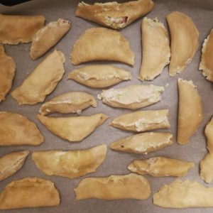 Step 7: The pies are about to go in the oven (note that you can see both versions A) and B) of closing them.