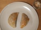 two Kalitsounia savoury pies on a plate in Crete, Greece