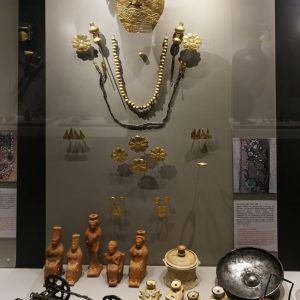 The full display of (female) Grave 458, with the richest and most elaborate content of all the female burials. Apart from the diadems and mask, as well as the perfume vessels illustrated above, there are bronze pins, bronze models of a cart and furniture, a bronze phiale (an offering vessel), as well as clay figurines and vessels in the shape of seated ladies. Circa 540 BC.
