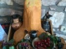 A simplified and fanciful version of what the central ancient sanctuary in Nakovana Cave may have looked like, with replicas of Greek vases and fruit offerings arranged around the centrepiece in <em>lieu</em> of the stalagmite - in a restaurant at Viganj in Croatia