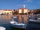 View of Supetar, the largest town and main port on the island of Brač in Croatia as seen from the water