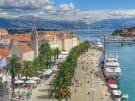 View over Trogir in Croatia including the promenada and mountains in the distance