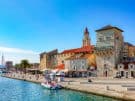 Photo of Trogir in Croatia showing a section of the historic city walls and the Kamerlengo fort