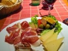 Local wine and a local charcuterie board at Donji Humac a restaurant on the island of Brač in Croatia