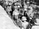 RAMC (Royal Army Medical Corps) stretcher bearers carrying a wounded soldier at Cape Helles in 1915.