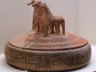 A pyxis (container most likely for jewellery) from the 8th century BC with Geometric decorations and sculpted horses, a symbol of wealth.
