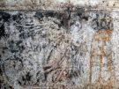 Detail of the wall painting in the burial chamber: a winged figure approaching a tripod. (Image: Greek Ministry of Culture)