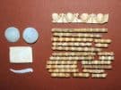 Fragments of the inlaid decorations of the lost wooden coffin or sarcophagus in the Kasta tomb. (Image: Greek Minisrty of Culture).