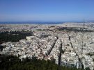 Central Athens, crowned by the Acropolis and overlooking the Saronic Gulf in the distance, as seen from Mt. Lykavitos.