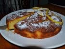 Cutting Italian lemon cake on a plate