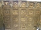 The ceiling of one of the Roman tombs at Sidyma, a single slab of stone carved with coffers holding flowers and faces