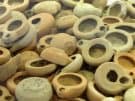 Mass produced Hellenistic oil lamps in the museum at Morgantina on Sicily
