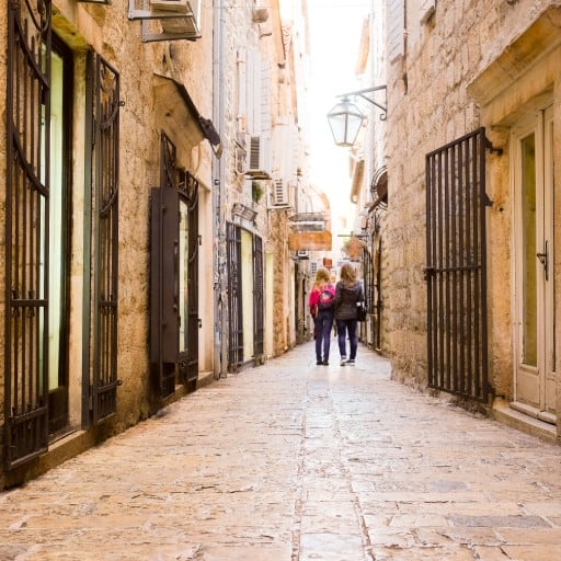 One of the ancient cobblestone streets of Budva’s Old Town, lined with shops and restaurants
