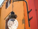 Glass lamp in one of the small squares of the old town of Šibenik in Croatia