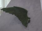 A find from the North Stoa – a bronze wing from a figurine of Eros; third-second centuries BC