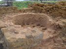 A pottery kiln built into the ruins of the great East Granary in the later Spanish period.