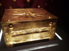 The rectangular gold ceremonial chest with an eight-pointed star embossed on the lid and rows of small floral decorations along the front and sides, that held the ashes of Philip II, on display in the museum at Vergina.