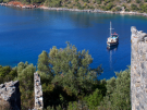 Looking from amongst the ruins on Gemiler island on the Lycian coast of Turkey north towards a gulet and the mainland