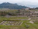 Elevated perspective of the excavated square Macellum marketplace and the adjacent monumental steps leading to upper terraces at Parco Archeologico di Morgantina in Aidone, Sicily.