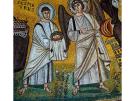 A 6th-century golden Byzantine mosaic from the Euphrasian Basilica in Poreč, Croatia. It shows Saint Maurus holding a golden martyr's crown in his draped hands, standing next to a winged archangel. Both figures are set against a shimmering gold background with delicate floral details at their feet.