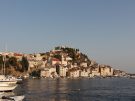 View of the old town of Šibenik in Croatia as seen from the north across the sea with boats in the foreground